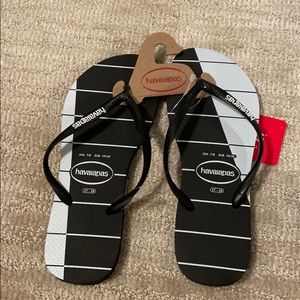 Black and white striped flip flops